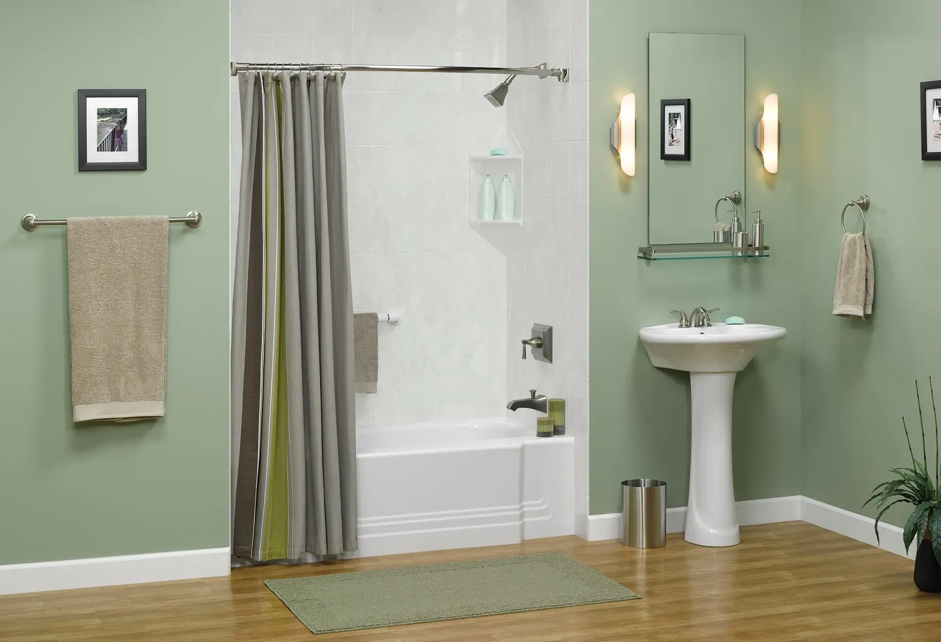 A light-green bathroom with white combination shower bathtub with a shower curtain.