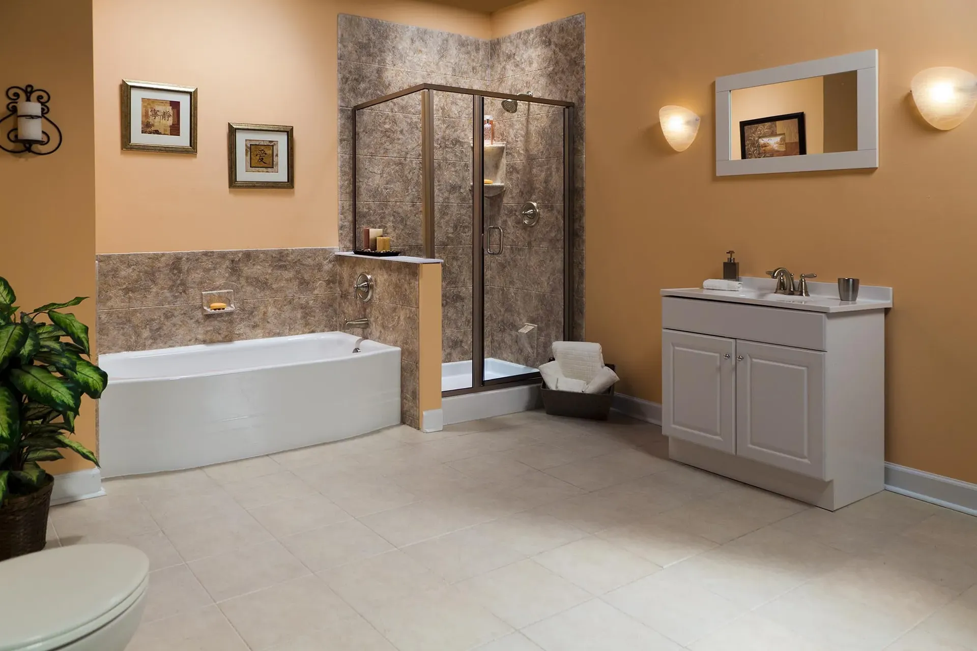 An orange bathroom with a large white soaking stand-alone tub on the left and a single shower stall on the right.